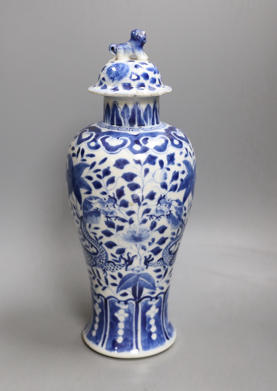 A Chinese blue and white 'dragon' vase and cover, Kangxi mark but 19th century. 33cm